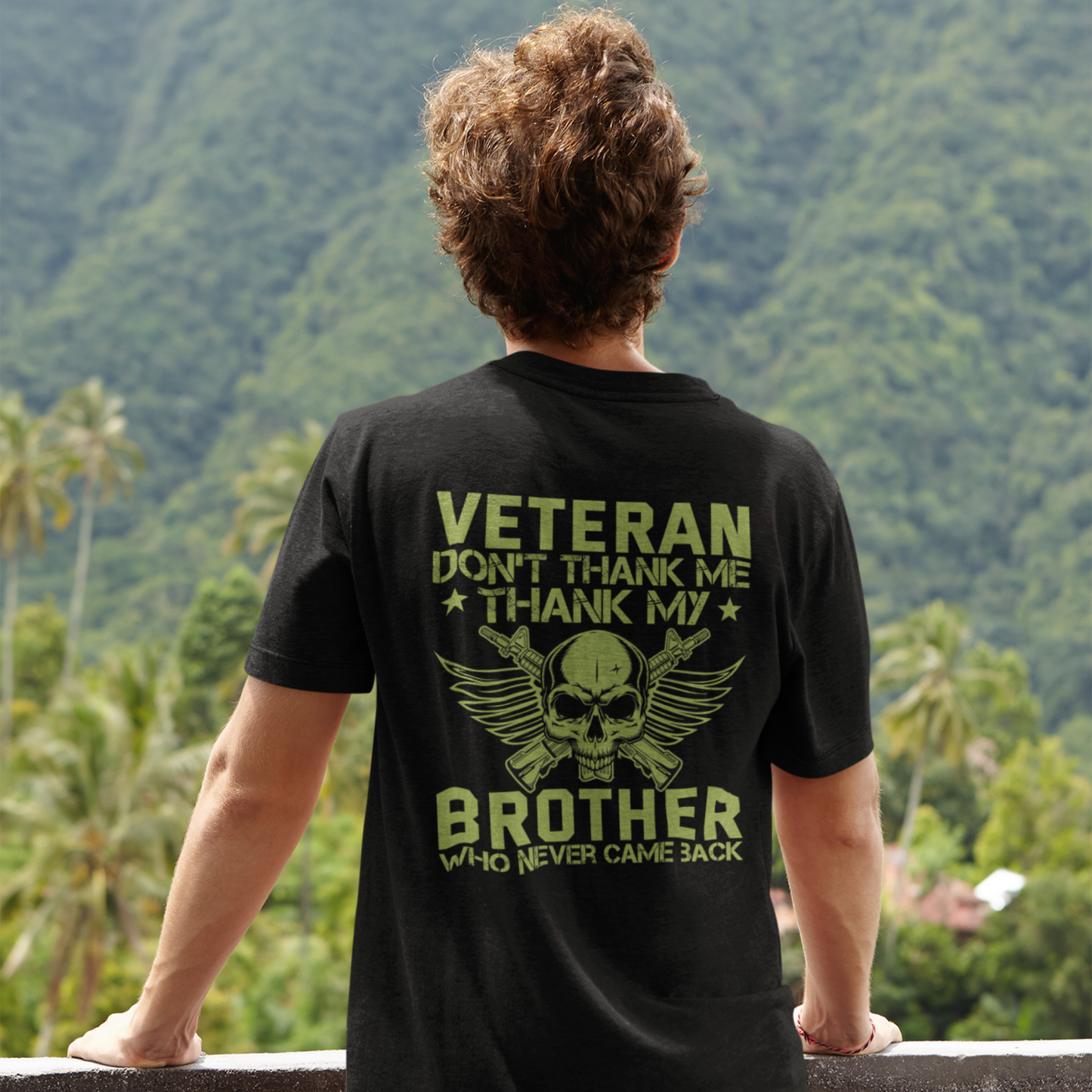 A person wearing a black T-shirt with text 'VETERAN DON'T THANK ME THANK MY BROTHER' and a graphic of a skull and wings on the front.