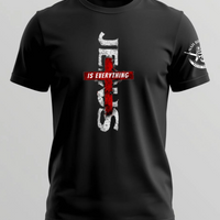 Black t-shirt with a red and white cross design on a gray background