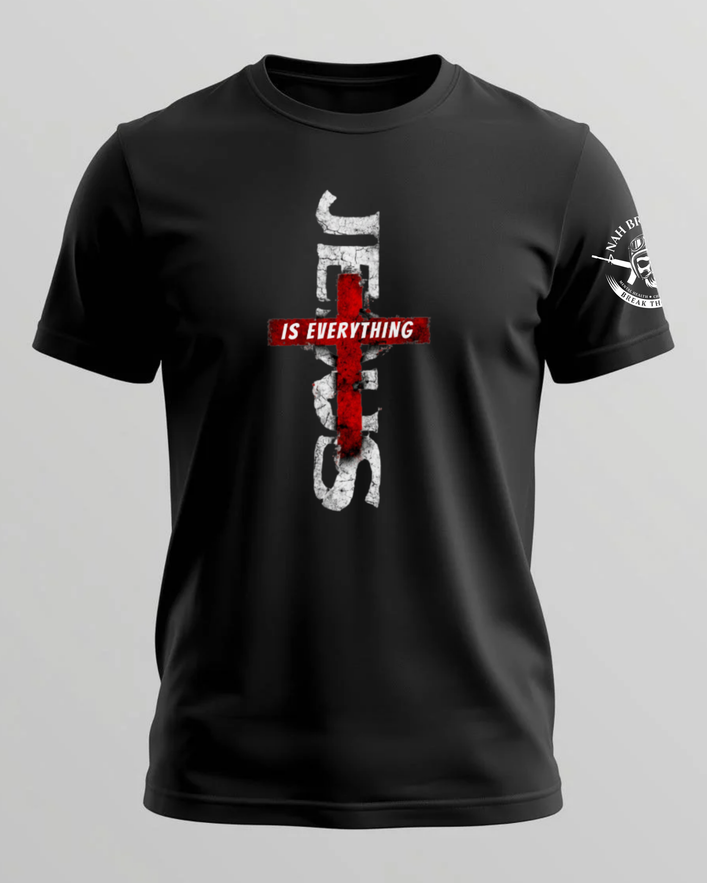 Black t-shirt with a red and white cross design on a gray background