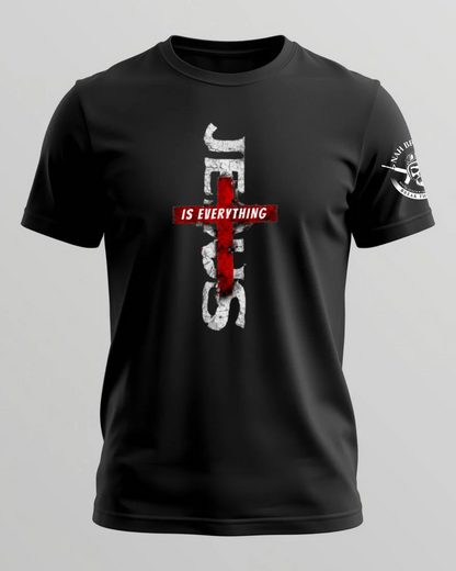 Black t-shirt with a red and white cross design on a gray background