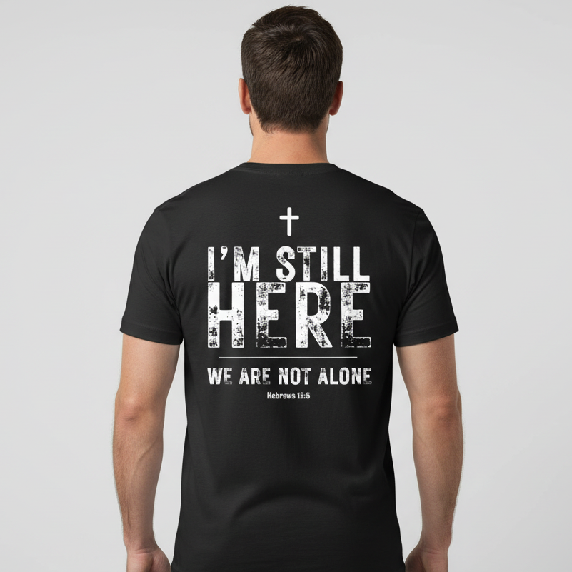 Person wearing a black t-shirt with a motivational message on the back against a plain background