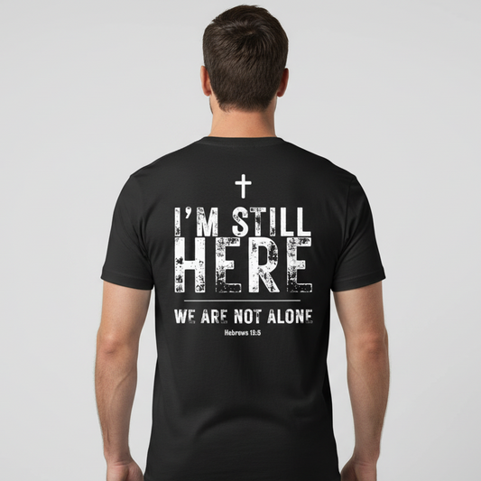 Person wearing a black t-shirt with a motivational message on the back against a plain background