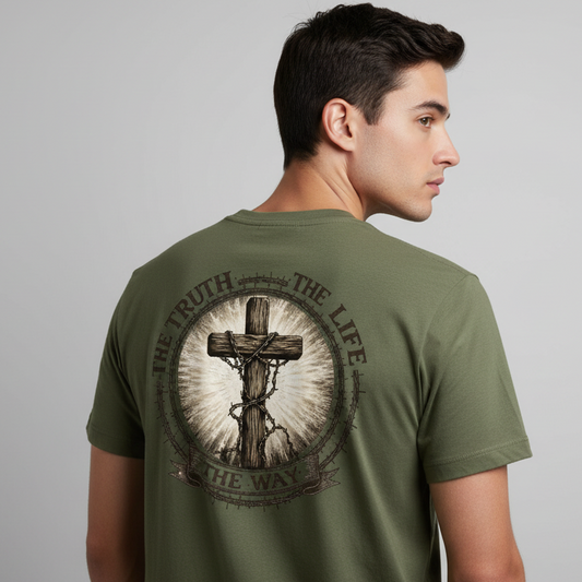 Man wearing a green t-shirt with a graphic design on the back against a gray background