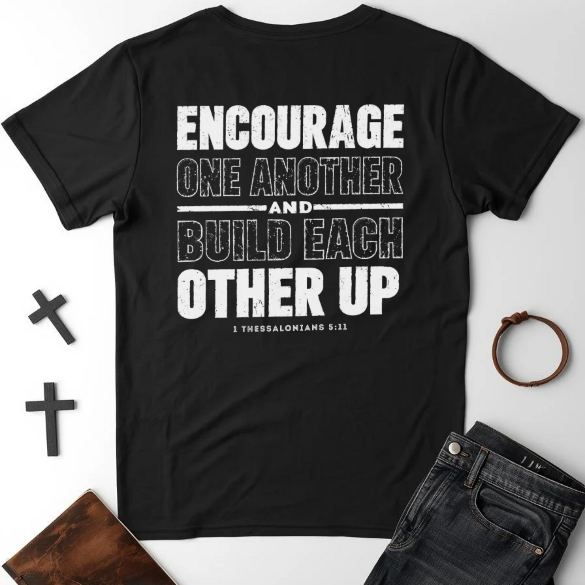 Black t-shirt with motivational quote on a white background