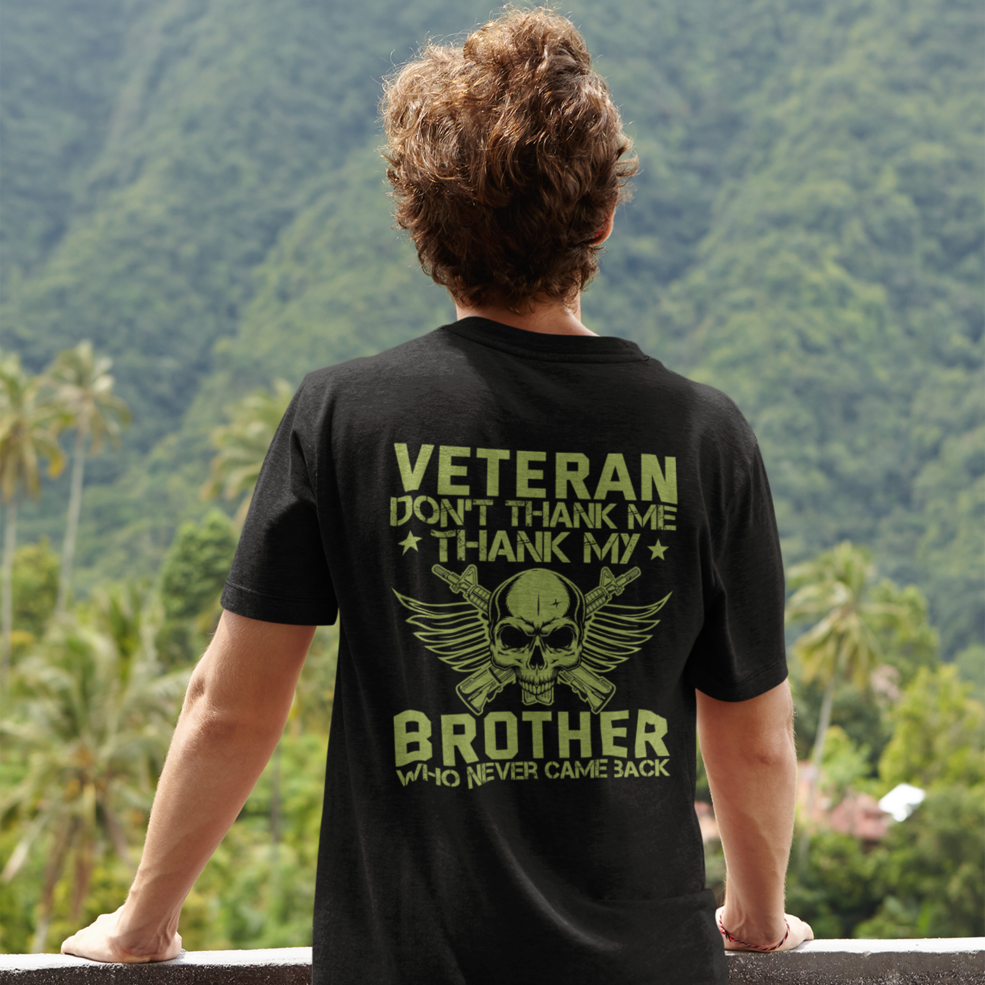 A person wearing a black T-shirt with text 'VETERAN DON'T THANK ME THANK MY BROTHER' and a graphic of a skull and wings on the front.