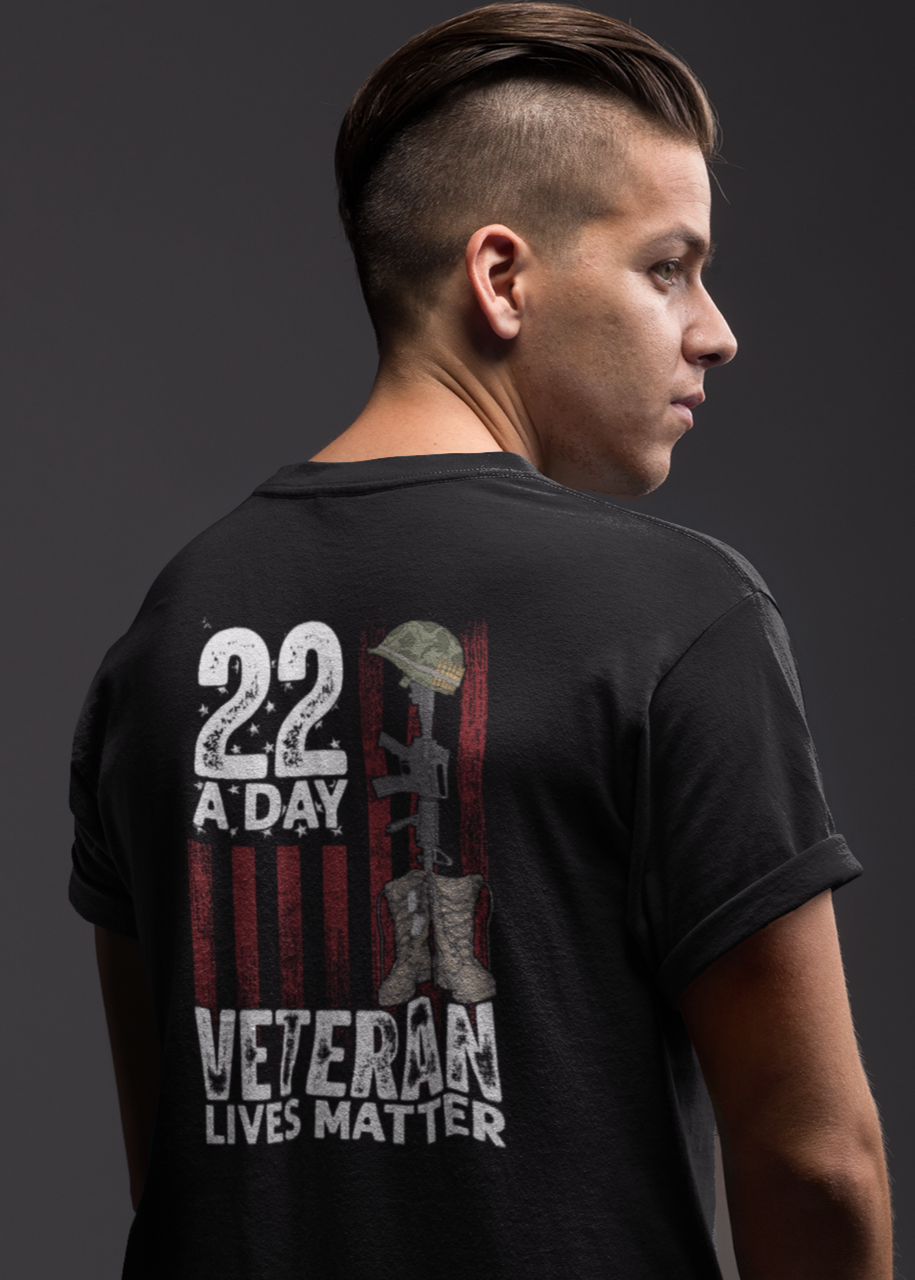 Person wearing a black t-shirt with '22 A Day Veteran Lives Matter' design on the back.