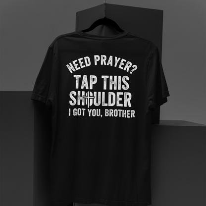 Black t-shirt with prayerful text design on a dark background