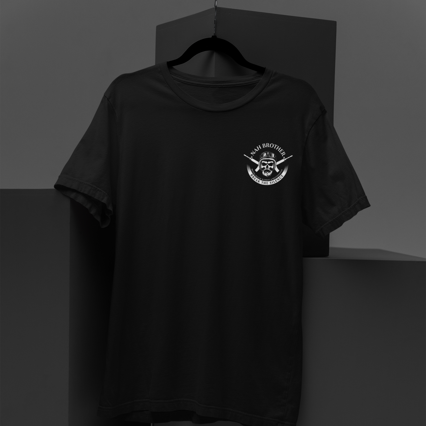 Black t-shirt with a white logo on a dark background