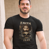 Man wearing a black t-shirt with a graphic design and text, sitting on a railing.